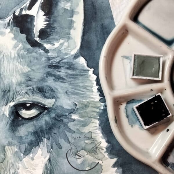 A watercolor painting of a wolf on a palette, available as an art print at Portugal Shop. Get the Wolf Print.
