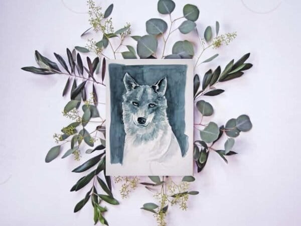 A Wolf Print of a watercolor painting of a wolf with eucalyptus leaves.