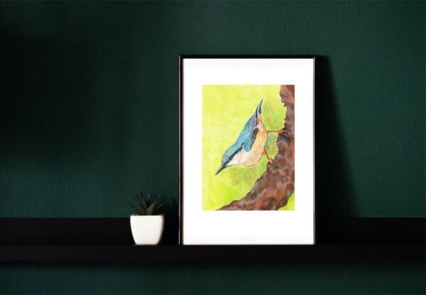 A framed print of a blue bird sitting on a branch.
