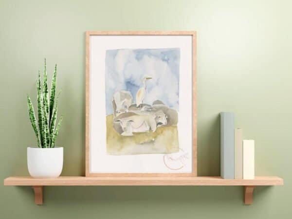 Watercolor print of an elephant on a shelf next to a plant featured in the Cattle Egret Print collection.