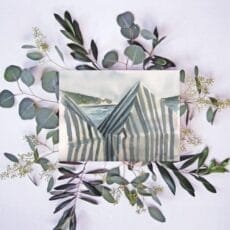 White striped beach tents print of eucalyptus leaves surrounded by a photo of a striped building.