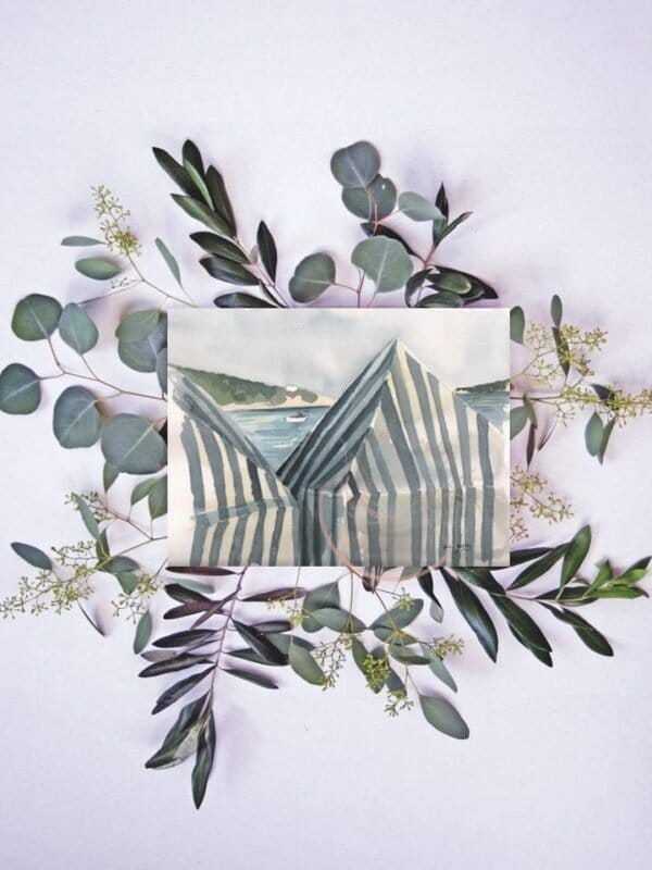 White striped beach tents print of eucalyptus leaves surrounded by a photo of a striped building.
