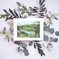 A Water dam Print with eucalyptus leaves around it.