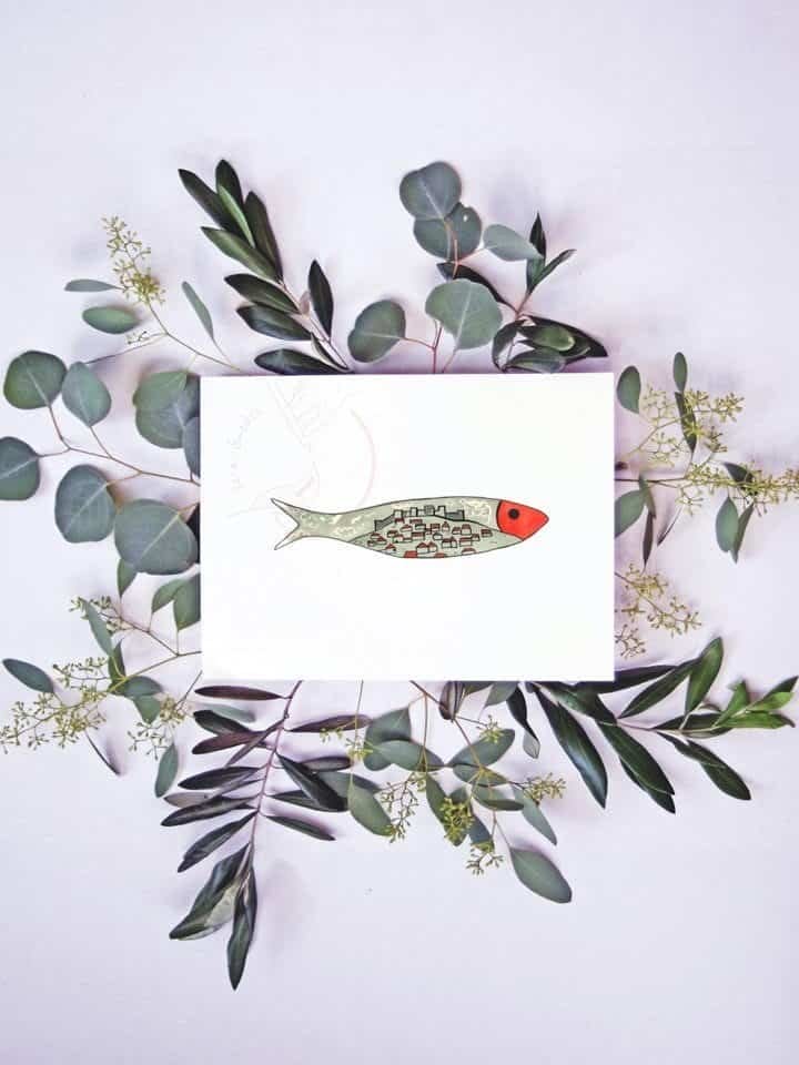 A card with an illustration of a Lisbon Sardine Print and eucalyptus leaves.